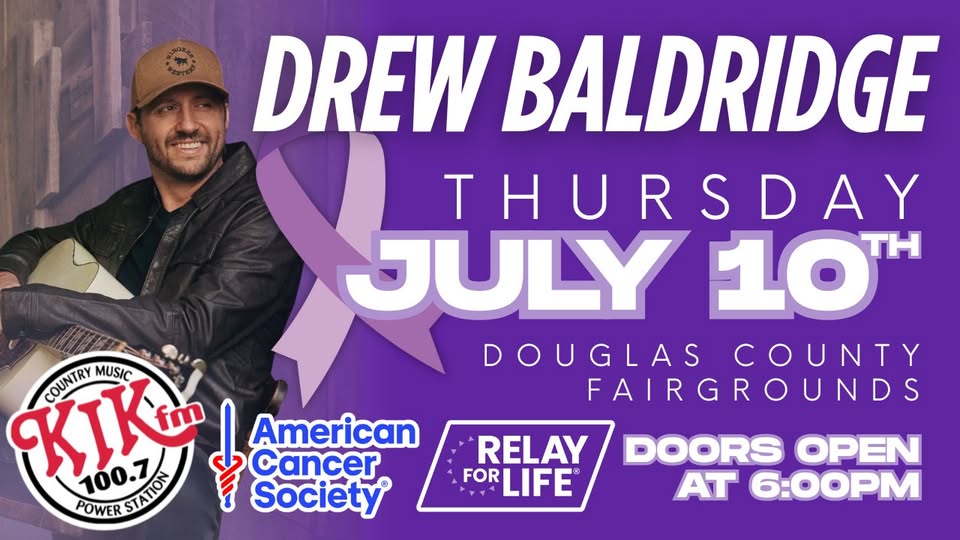 Country singer Drew Baldridge smiles with his guitar at a Relay for Life Concert, happening Thursday, July 10 at Douglas County Fairgrounds. Logos for KIX FM, American Cancer Society, and Relay for Life are displayed.
