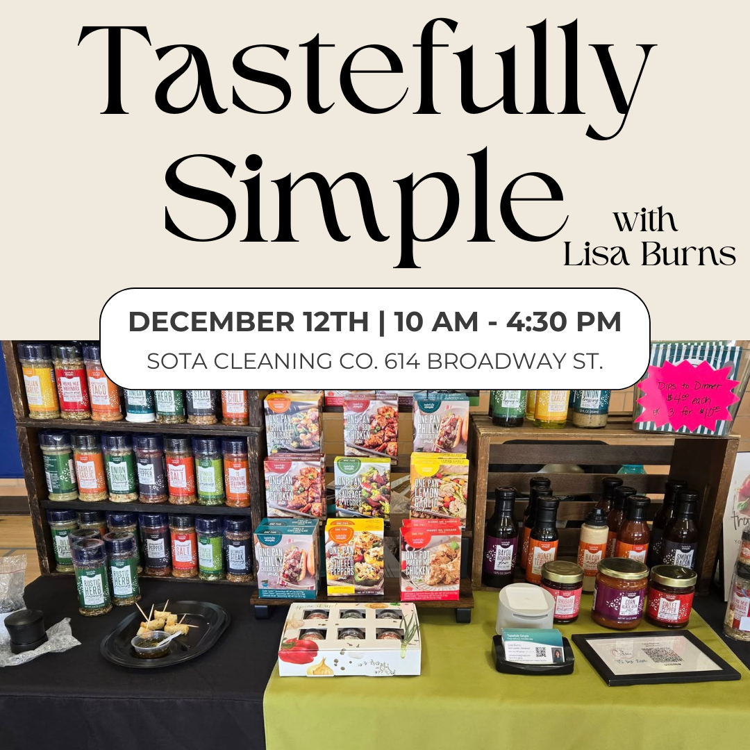 A Tastefully Simple Pop Up display table features products, samples, and flyers in front of shelves. Text reads: "Tastefully Simple with Lisa Burns. December 12th | 10 AM - 4:30 PM. SOTA Cleaning Co. 614 Broadway St.